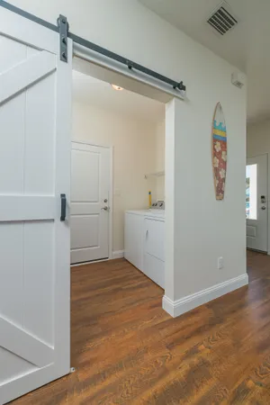 a kitchen with a refrigerator a sink and cabinets