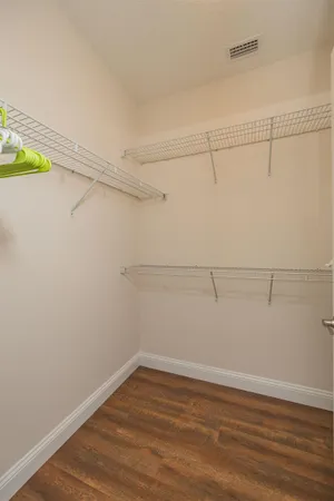 a bedroom with bed and a window