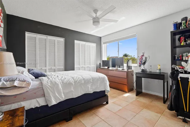 a bedroom with a bed furniture and a window