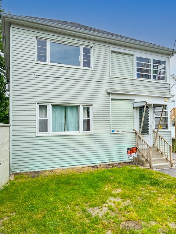 153 Field Street Fall River, MA 02721 - Photo 1 of 9 a front view of a house with a yard