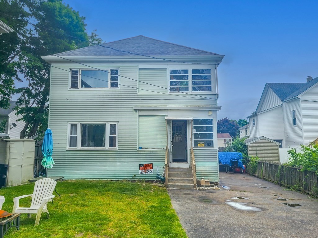 153 Field Street Fall River, MA 02721 - Photo 2 of 9 a view of a house with a yard