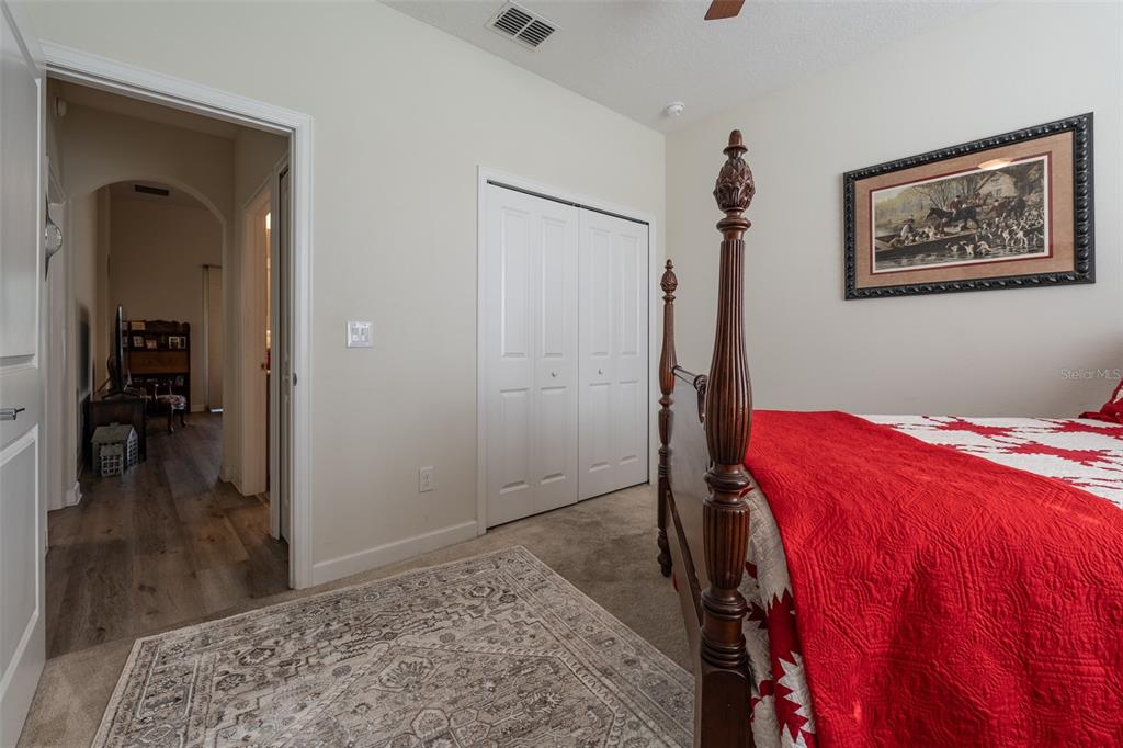 9224 Southwest 60th Ct Road Ocala, FL 34476 - Photo 41 of 55 a bedroom with a bed and a view of bathroom