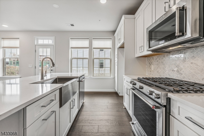 3 Sternadori Road Somerville, NJ 08876 - Photo 4 of 22 a kitchen with stainless steel appliances granite countertop a stove a sink and a microwave