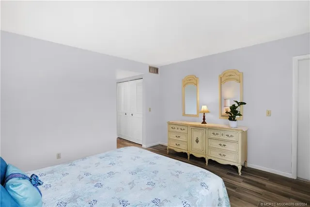 a dining room with furniture and a floor to ceiling window