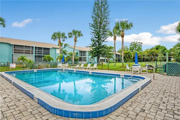 a bathroom with a shower and a mirror