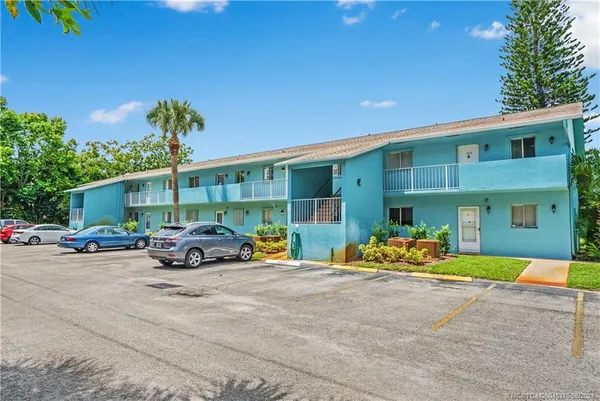 a view of a house with swimming pool and porch