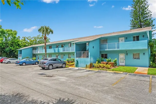 a view of a house with swimming pool and porch