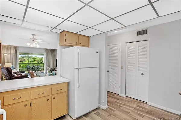 a kitchen with a sink cabinets and appliances