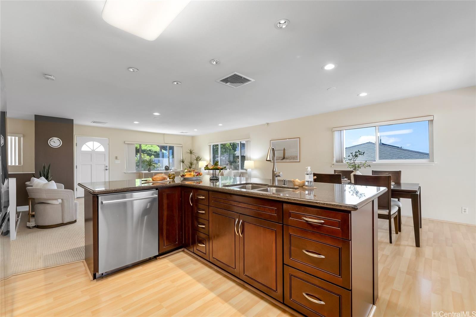 4562 Malia Street Honolulu, HI 96821 - Photo 1 of 25 a kitchen with a sink stove and wooden cabinets