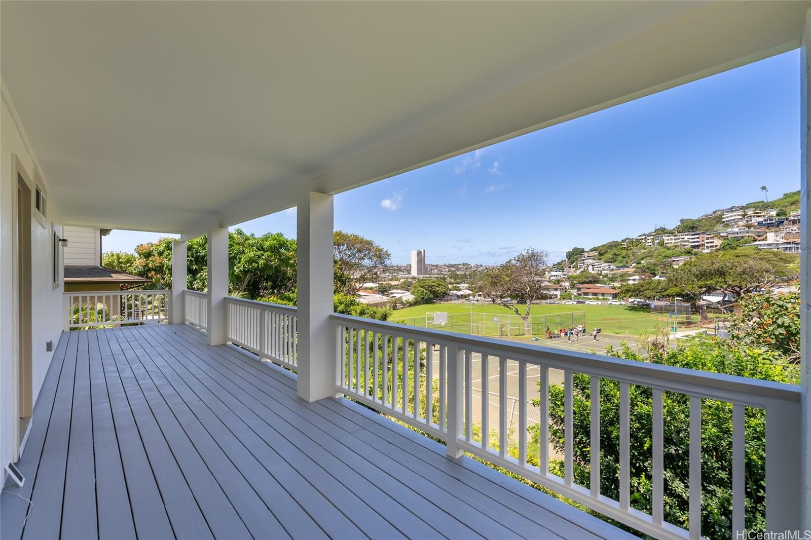 4562 Malia Street Honolulu, HI 96821 - Photo 12 of 25 a view of balcony with wooden floor