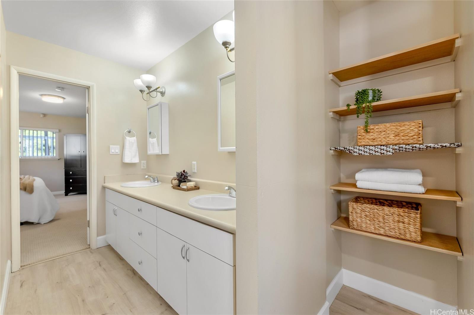 4562 Malia Street Honolulu, HI 96821 - Photo 16 of 25 a bathroom with a sink a toilet and mirror