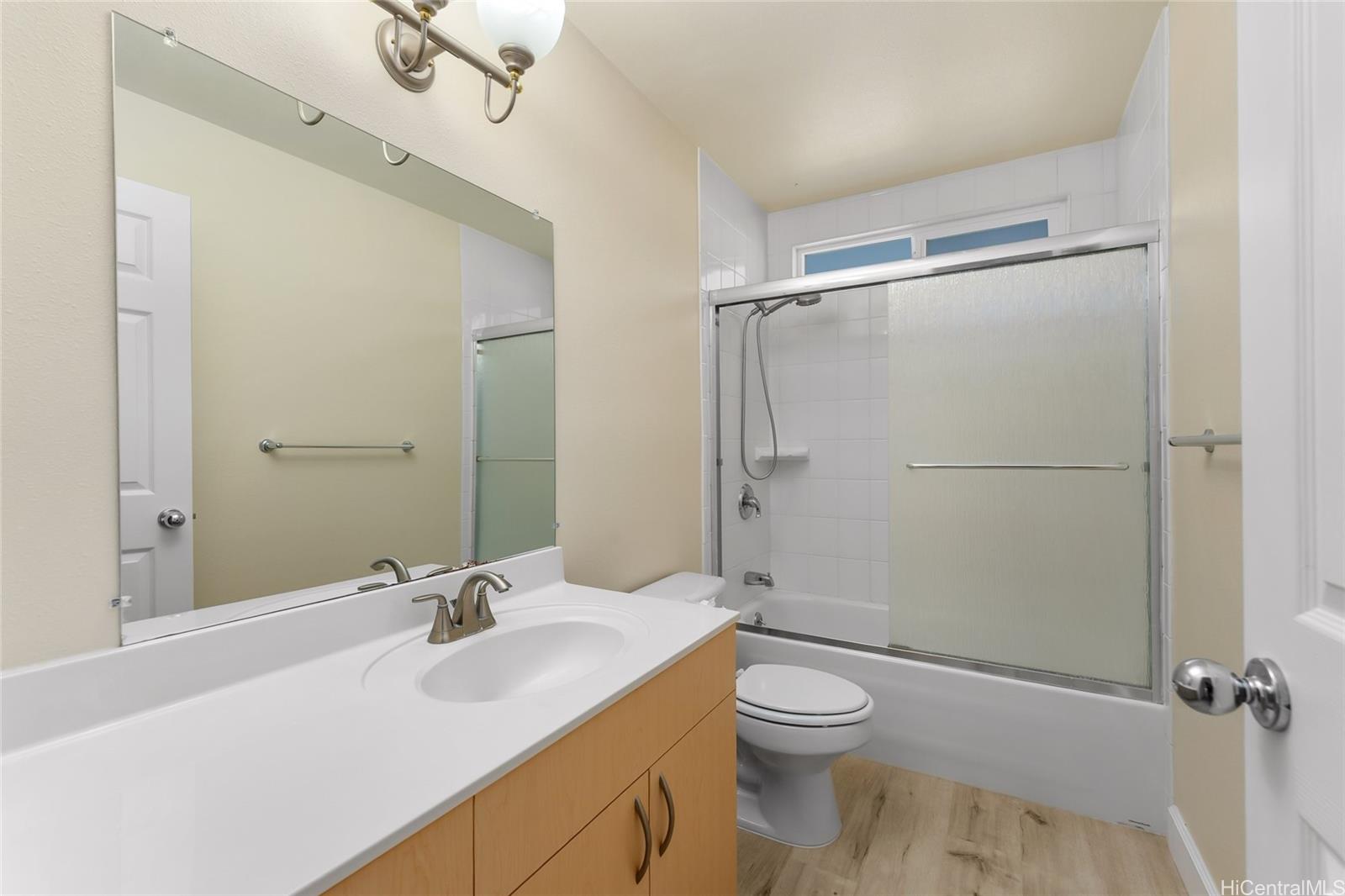 4562 Malia Street Honolulu, HI 96821 - Photo 19 of 25 a bathroom with a sink toilet and shower