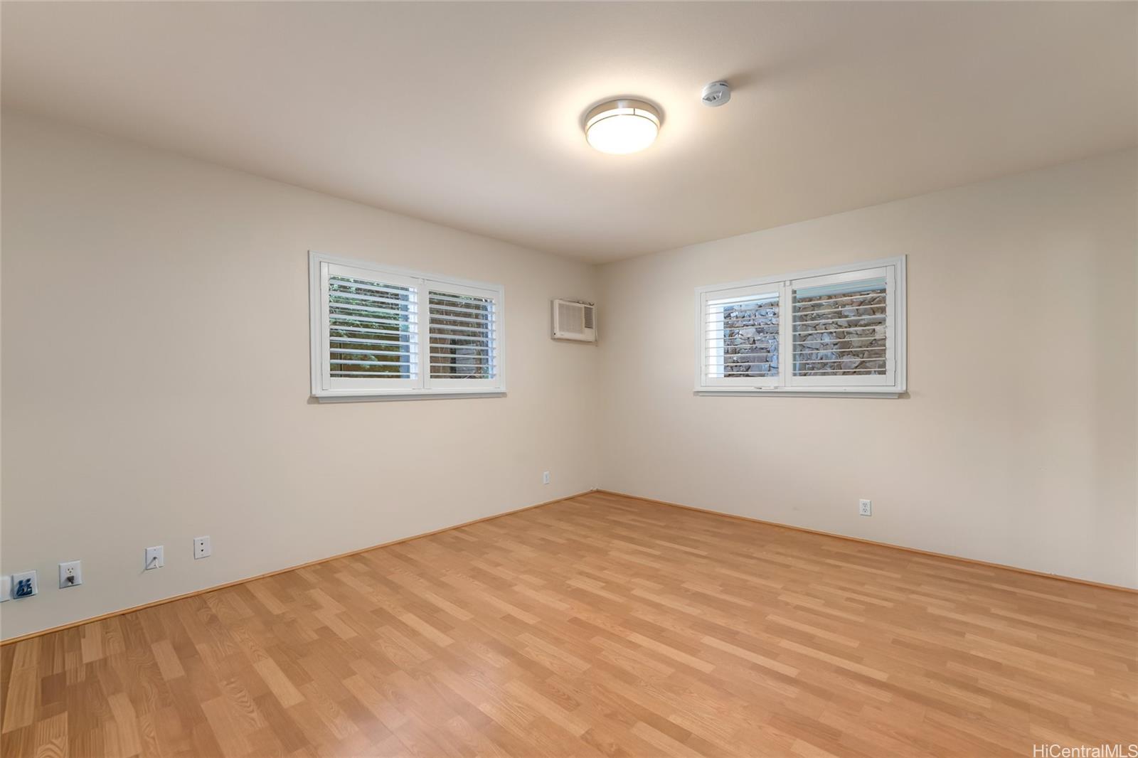 4562 Malia Street Honolulu, HI 96821 - Photo 21 of 25 a view of an empty room with a window