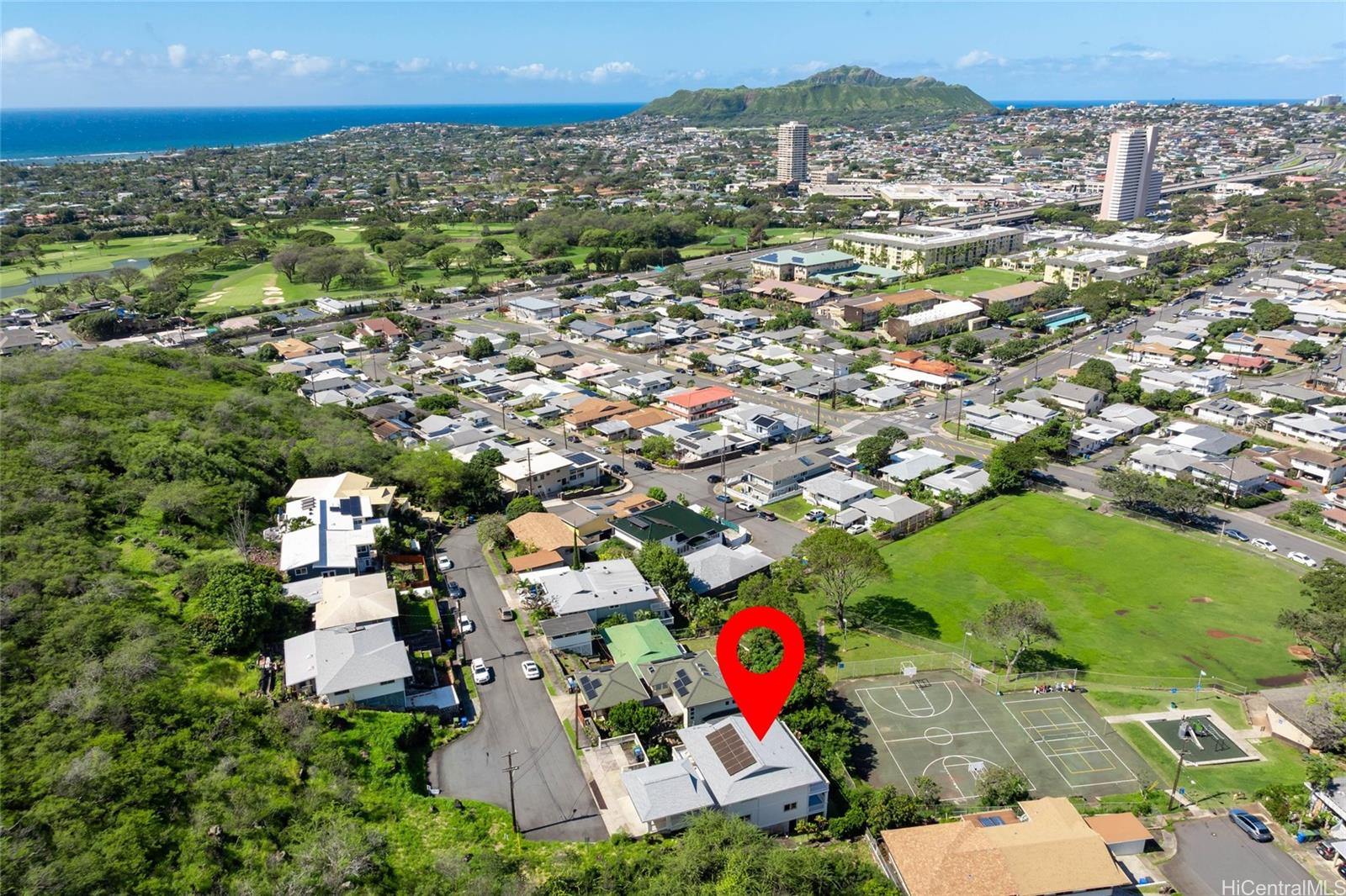 4562 Malia Street Honolulu, HI 96821 - Photo 23 of 25 an aerial view of residential houses with outdoor space and trees