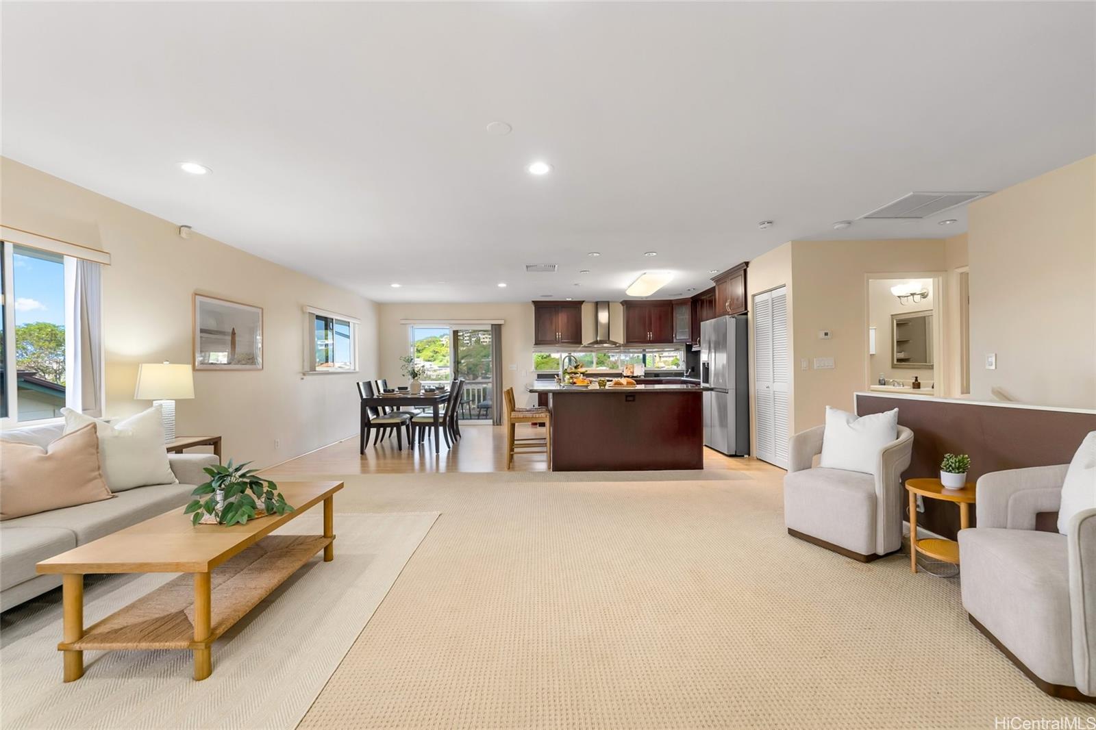 4562 Malia Street Honolulu, HI 96821 - Photo 4 of 25 a living room with furniture and kitchen area