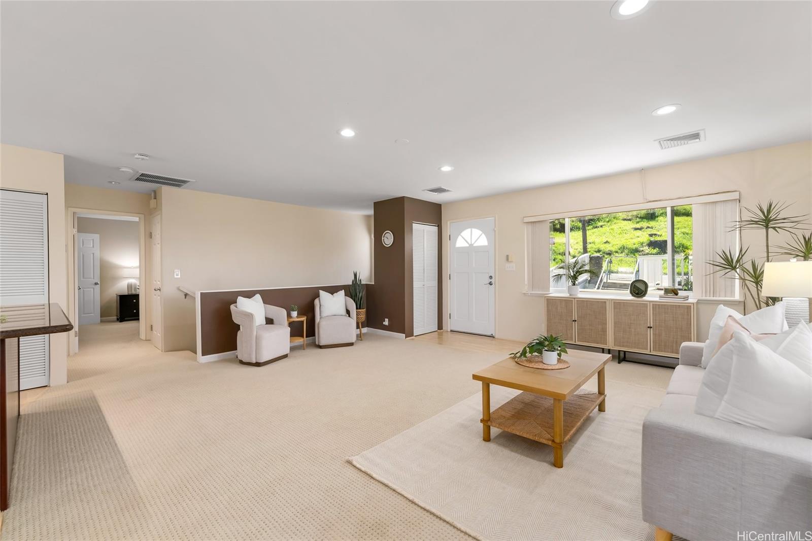 4562 Malia Street Honolulu, HI 96821 - Photo 6 of 25 a living room with furniture and a large window