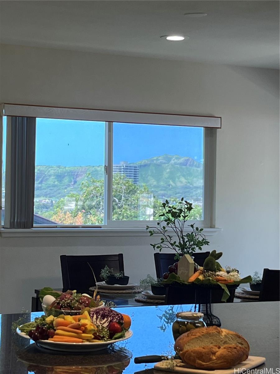 4562 Malia Street Honolulu, HI 96821 - Photo 9 of 25 a room with furniture and a potted plant