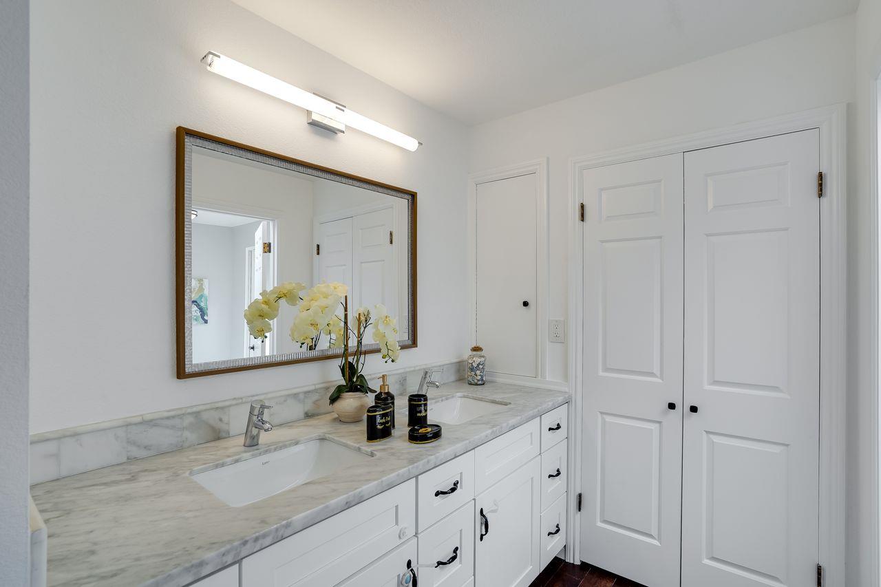 1176 Millbrae Avenue Millbrae, CA 94030 - Photo 28 of 47 a bathroom with double vanity sink and a mirror