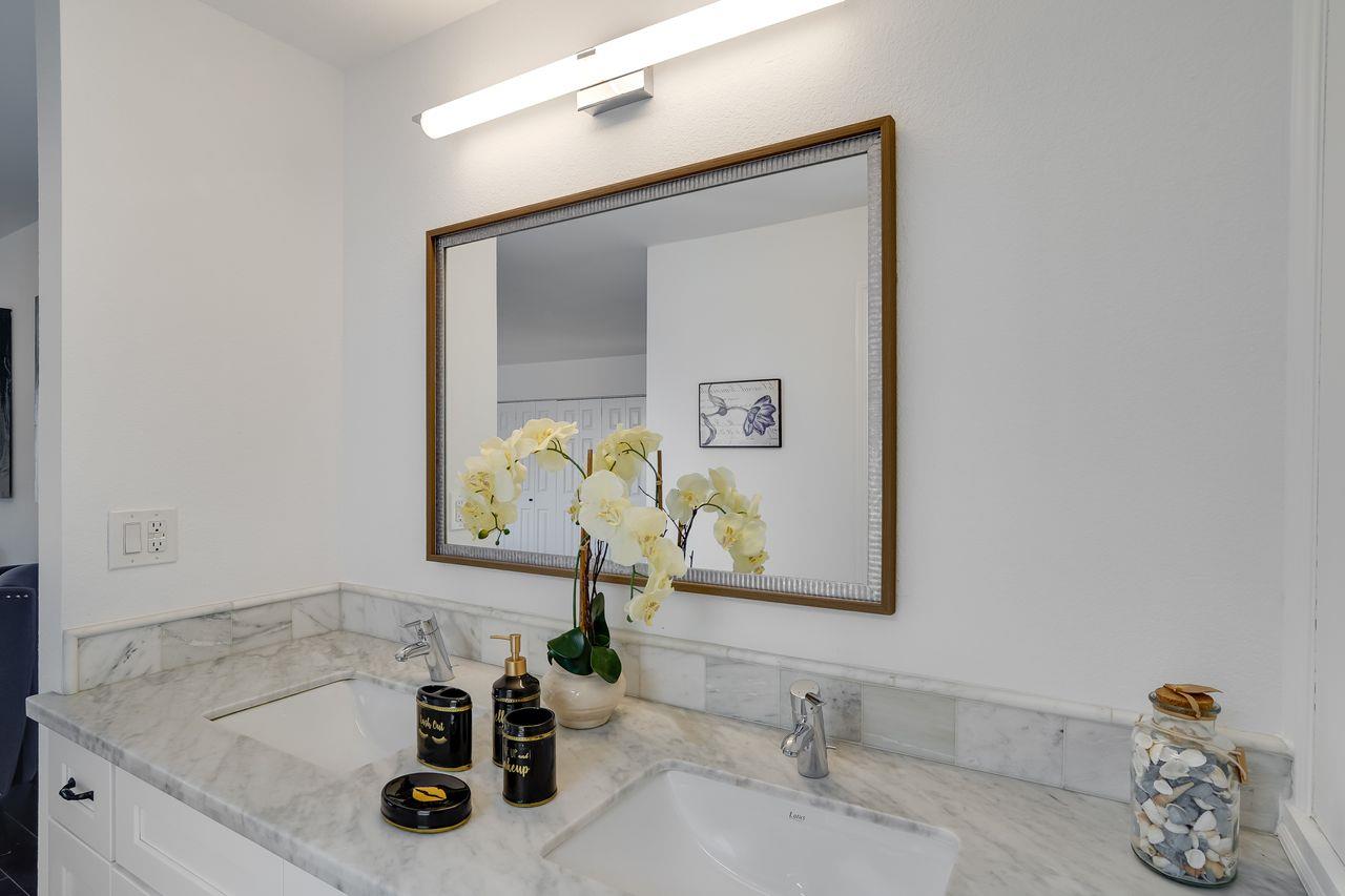 1176 Millbrae Avenue Millbrae, CA 94030 - Photo 29 of 47 a bathroom with a sink and a mirror