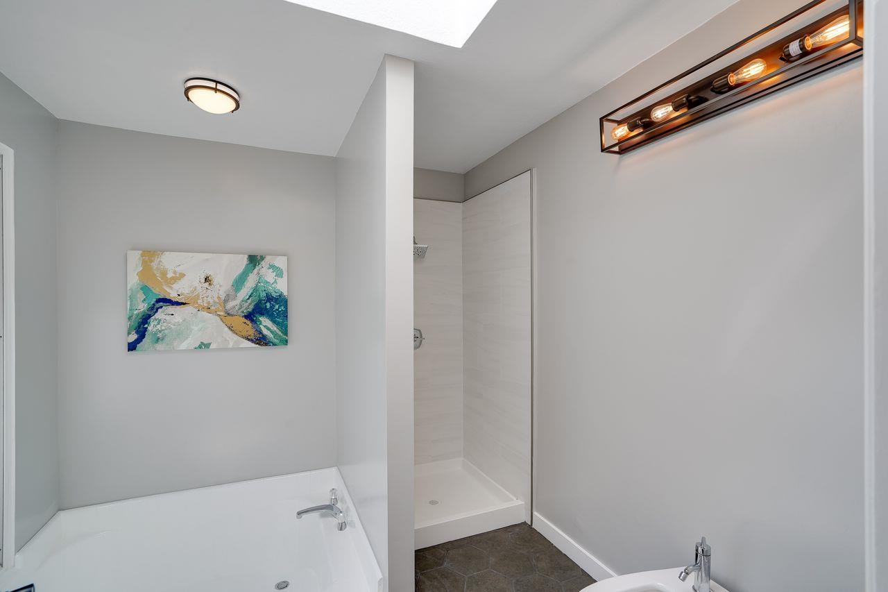 1176 Millbrae Avenue Millbrae, CA 94030 - Photo 30 of 47 a bathroom with a painting on the wall and shower