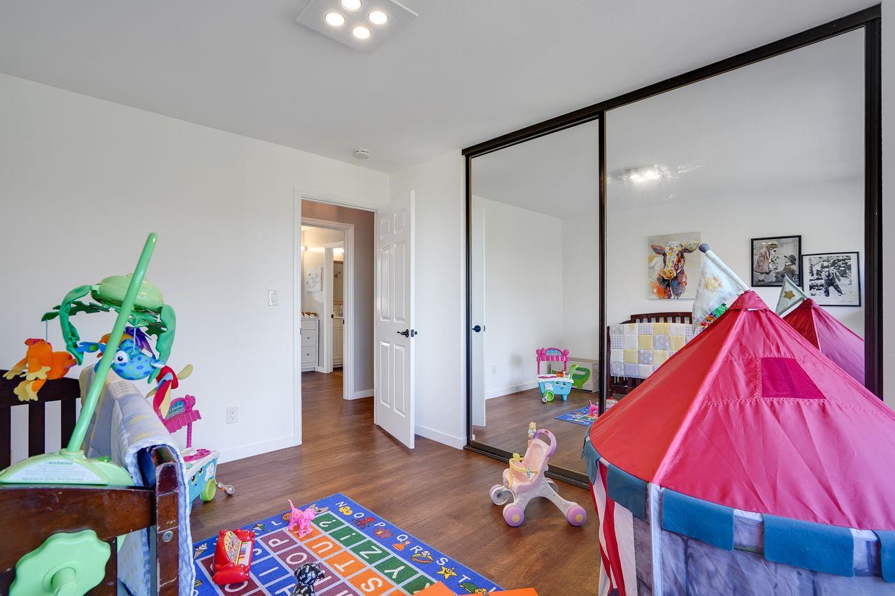 1176 Millbrae Avenue Millbrae, CA 94030 - Photo 33 of 47 a room with furniture and a lamp