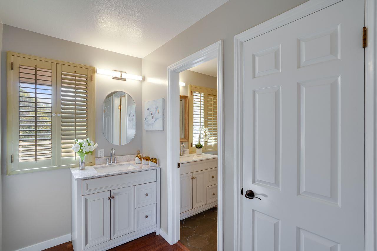1176 Millbrae Avenue Millbrae, CA 94030 - Photo 34 of 47 a spacious bathroom with a mirror a sink and a shower