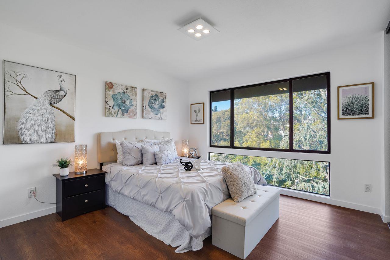 1176 Millbrae Avenue Millbrae, CA 94030 - Photo 37 of 47 a bed room with a bed and a large window