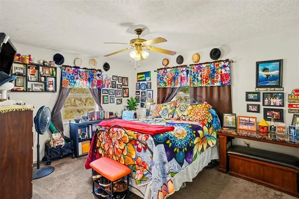 a bedroom with furniture and a chandelier