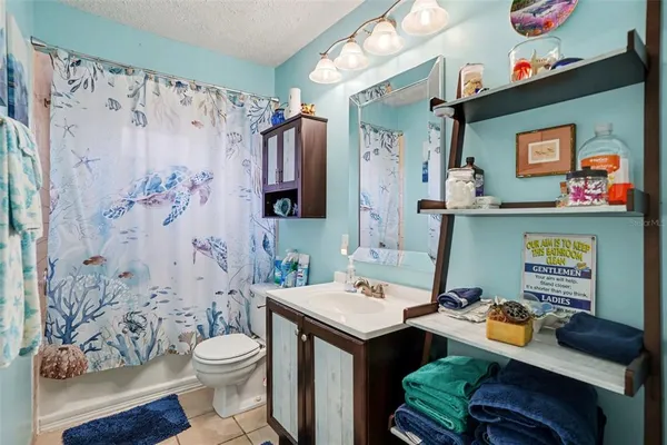 a bathroom with a sink vanity and a mirror