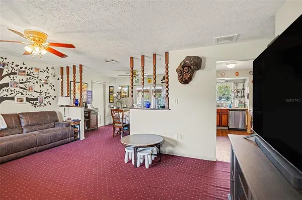 a living room with furniture and a window