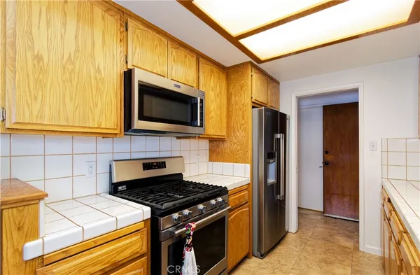 a kitchen with a stove and a microwave