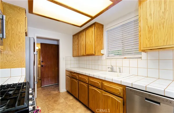 a kitchen that has a sink and a window in it