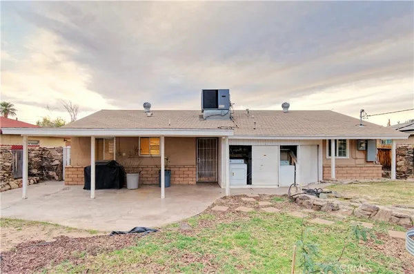 a house view with a backyard space