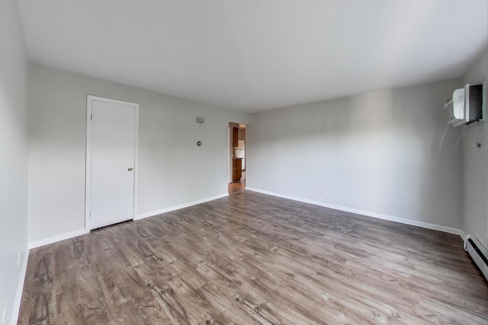 333 Short Street, Unit 2 Lemont, IL 60439 - Photo 2 of 11 a view of empty room with wooden floor