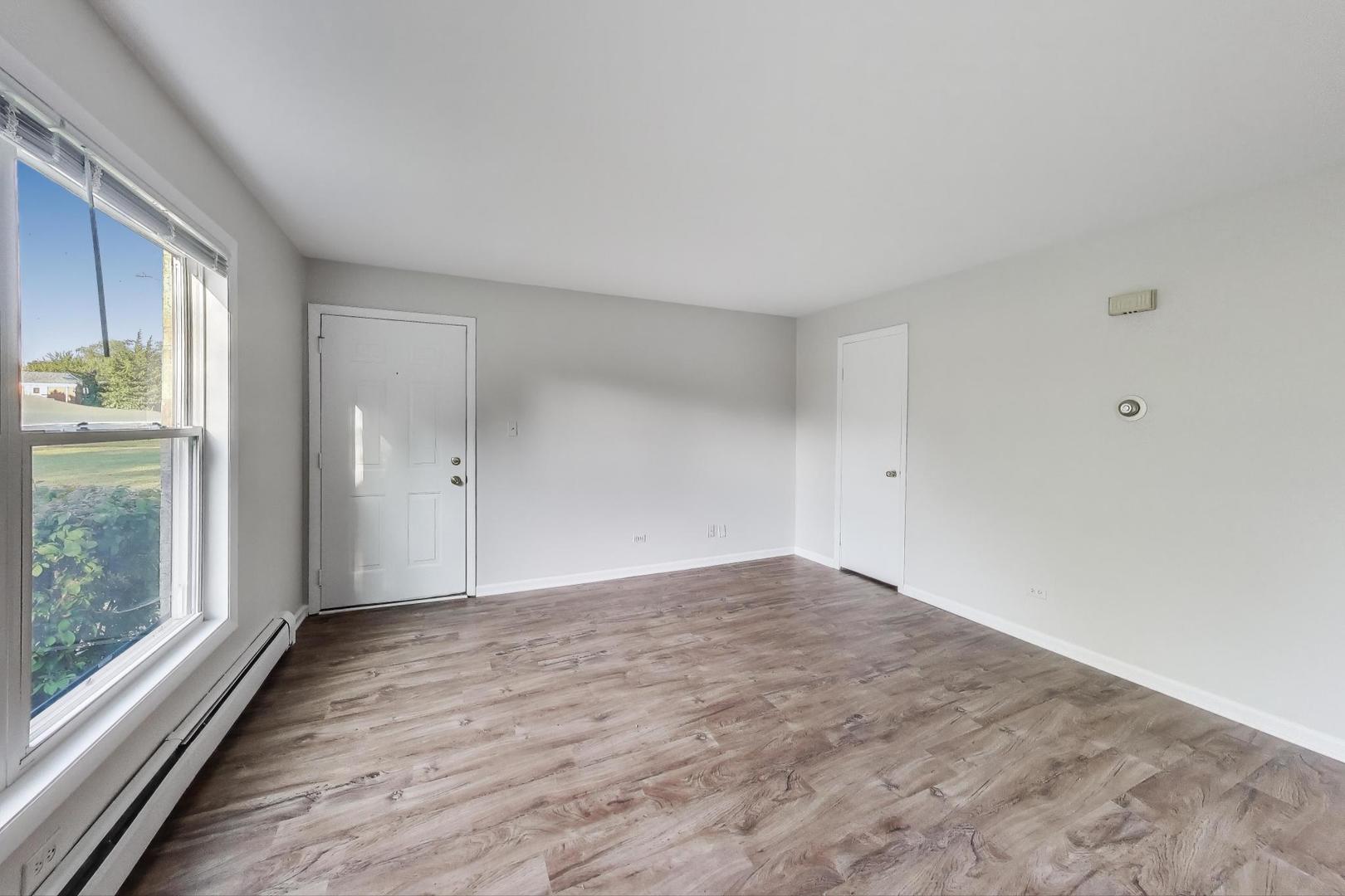 333 Short Street, Unit 2 Lemont, IL 60439 - Photo 3 of 11 a view of an empty room and window