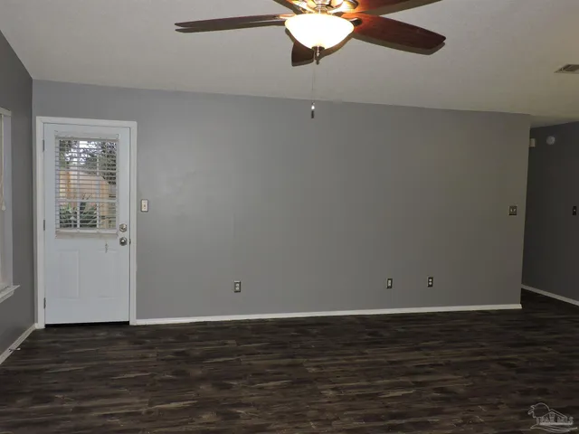 a view of a kitchen with granite countertop stainless steel appliances and wooden floor