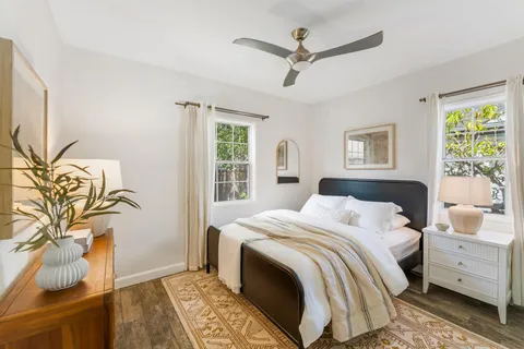 a bedroom with a large bed and a window