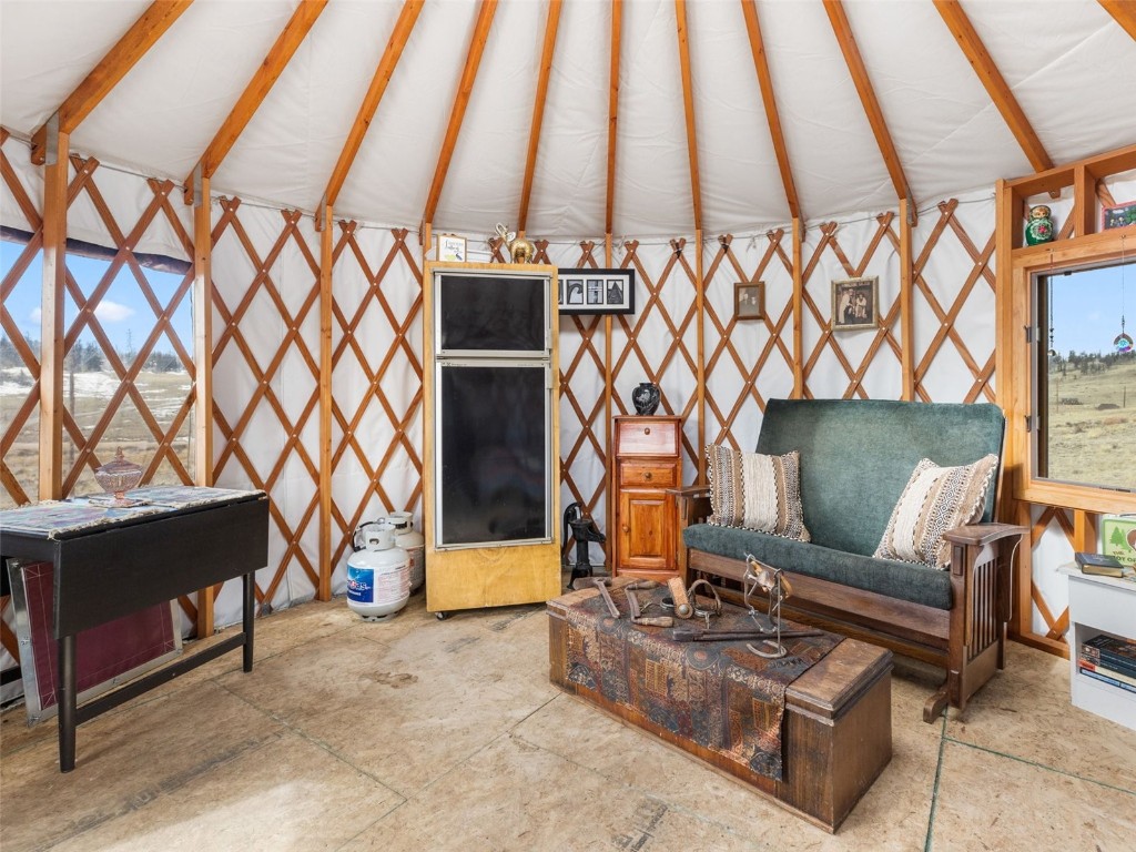 1642 Longbow Drive Como, CO 80432 - Photo 6 of 13 a living room with furniture and a fireplace