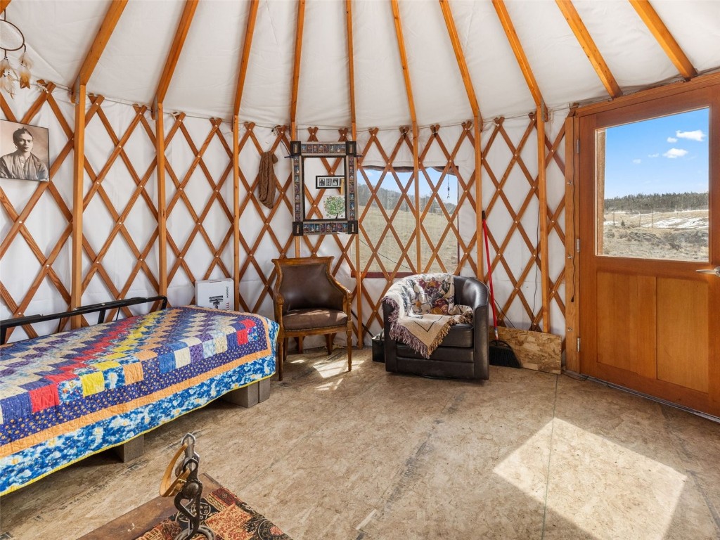 1642 Longbow Drive Como, CO 80432 - Photo 7 of 13 a bedroom with a bed and furniture