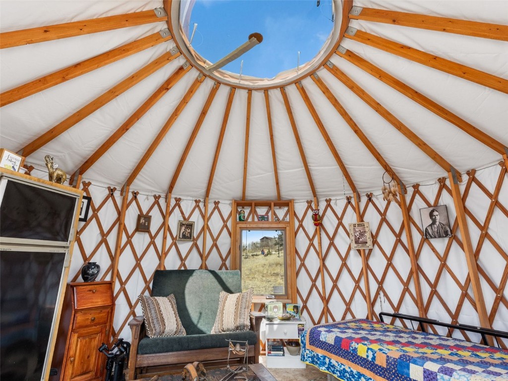 1642 Longbow Drive Como, CO 80432 - Photo 8 of 13 a view of a room with racks and a chair