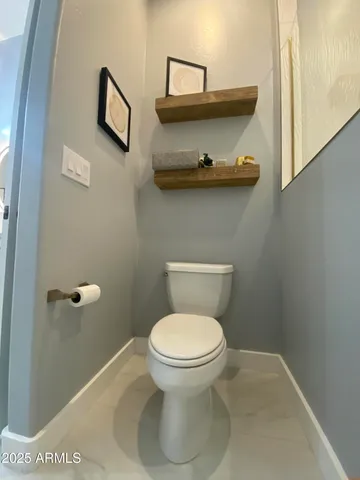 a bathroom with a toilet and a sink