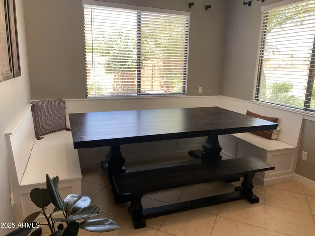 a workstation with a large window and a chair next to a window