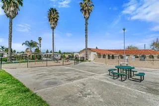 a view of a patio with a table and chairs