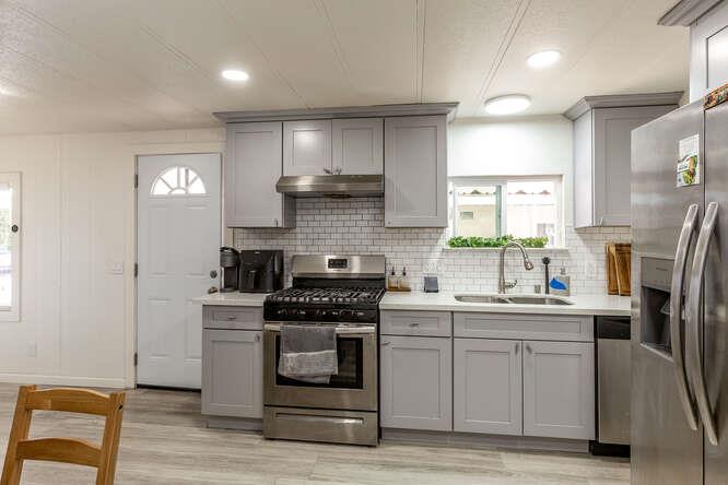 2151 Oakland Road, Unit 297 San Jose, CA 95131 - Photo 3 of 34 a kitchen with a sink stove and refrigerator