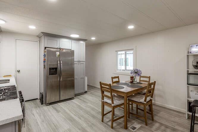 2151 Oakland Road, Unit 297 San Jose, CA 95131 - Photo 5 of 34 a kitchen with a table and refrigerator