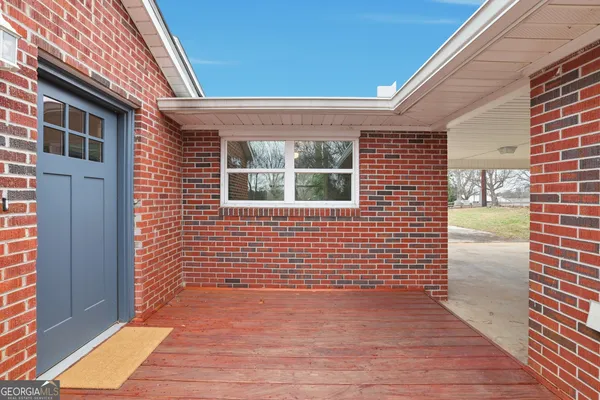 a view of a brick house with wooden floor