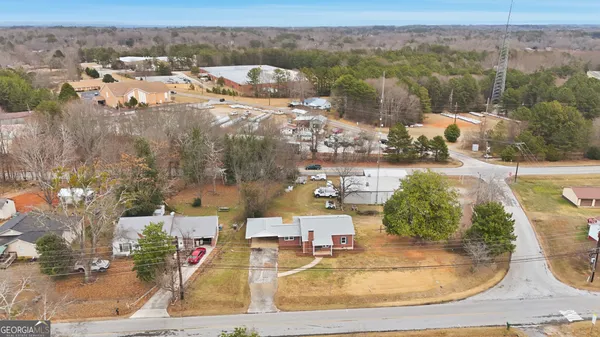 an aerial view of a house with outdoor space