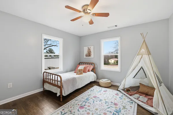 a bed room with a bed and a window