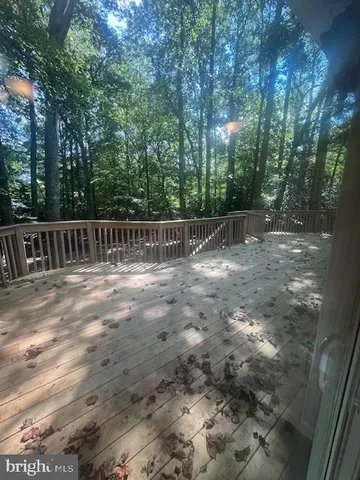 a view of deck with a trees