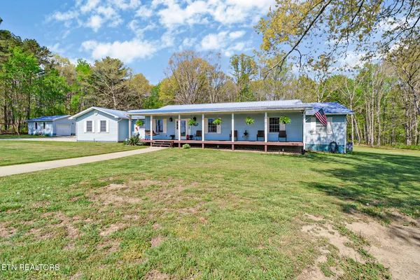 front view of a house with a big yard